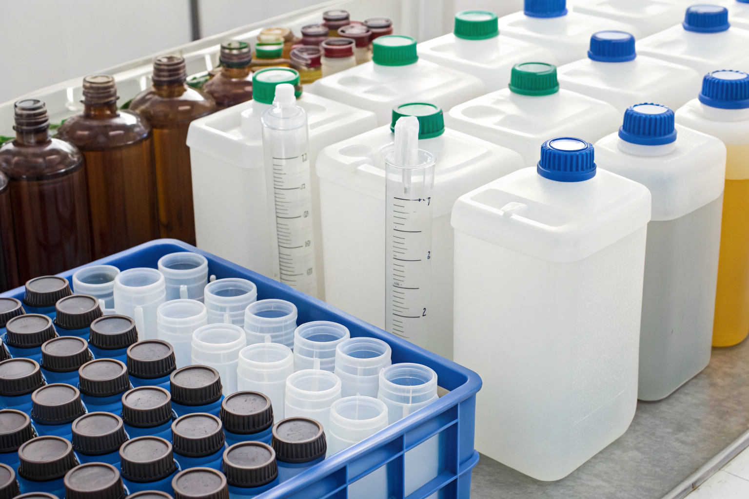 Different water sample containers labeled by test type, detailed view.