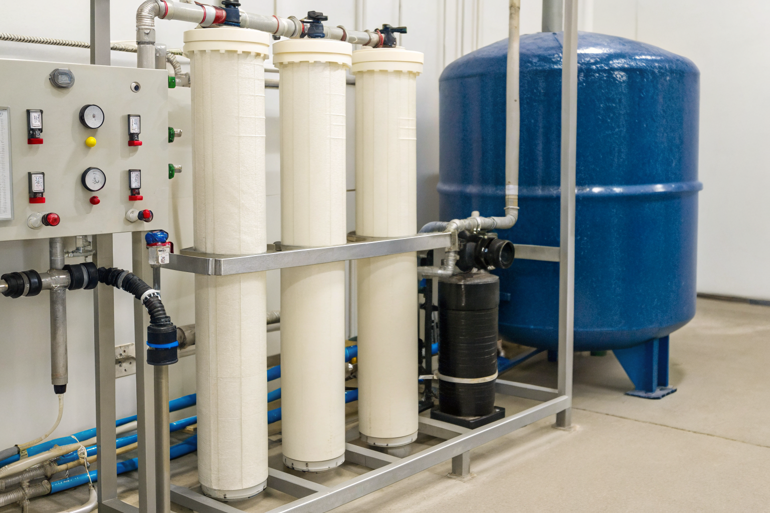 Water treatment system components with resin tank and salt container.
